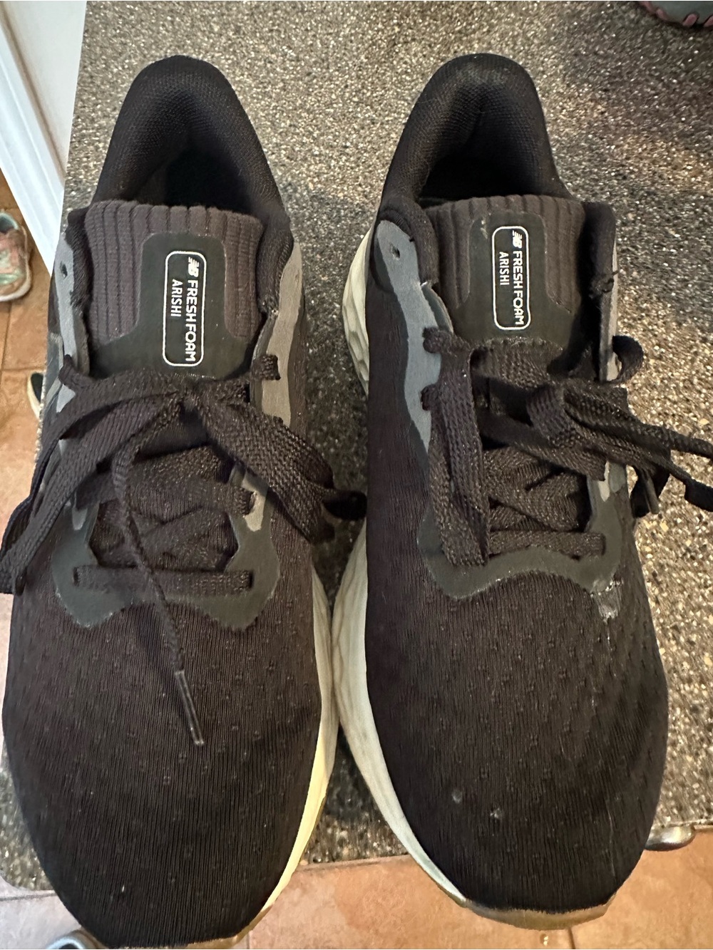 New Balance Black Athletic Running Shoes with White Midsole